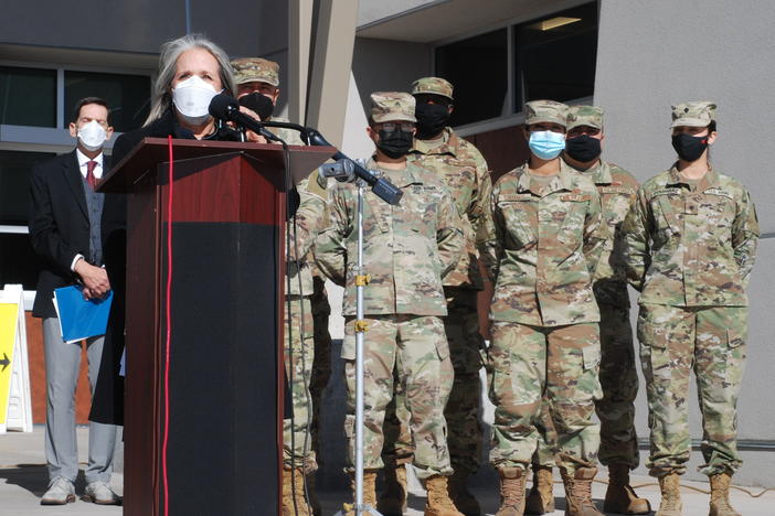 New Mexico Gov. Michelle Lujan Grisham announced efforts to temporarily employ National Guard troops and state workers as substitute teachers and child care center workers during a news conference at Sante Fe High School in Santa Fe, N.M., on Tuesday.