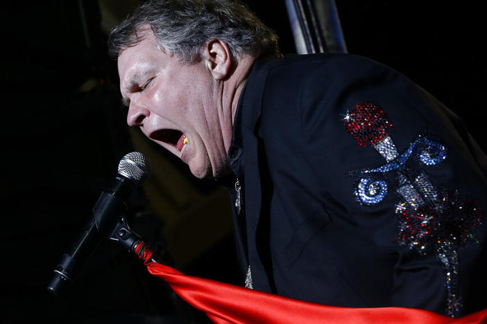 Singer Meat Loaf performs in support of Republican presidential candidate and former Massachusetts Gov. Mitt Romney at the football stadium at Defiance High School in Defiance, Ohio, Thursday, Oct. 25, 2012.