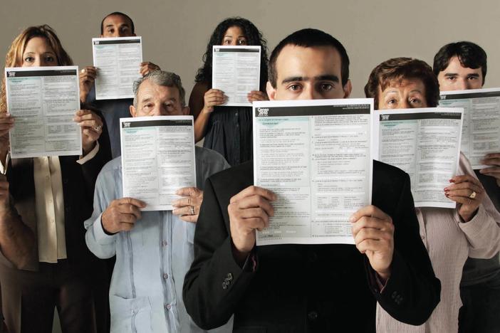 People conceal parts of their faces with forms for the 2010 count in Puerto Rico in a U.S. Census Bureau poster about how it keeps information confidential. Records for the once-a-decade tally cannot be released until 72 years after a count's Census Day.