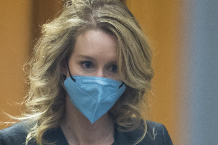 Elizabeth Holmes walks into federal court in San Jose, Calif., in January 2022.