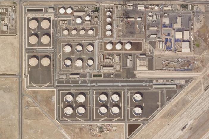This satellite image provided by Planet Labs PBC shows the aftermath of an attack claimed by Yemen's Houthi rebels on an Abu Dhabi National Oil Co. fuel depot in the Mussafah neighborhood of Abu Dhabi, United Arab Emirates, Saturday, Jan. 22, 2022.