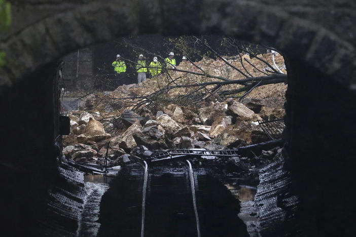 A road collapsed onto train tracks in Baltimore, Md. in 2014 after heavy rain. The city is facing millions of dollars in infrastructure upgrades to cope with the effects of climate change.