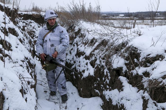 A soldier pauses in territory controlled by pro-Russian militants in eastern Ukraine. The U.S. and its allies are preparing responses and counter-responses if Russia invades Ukraine.
