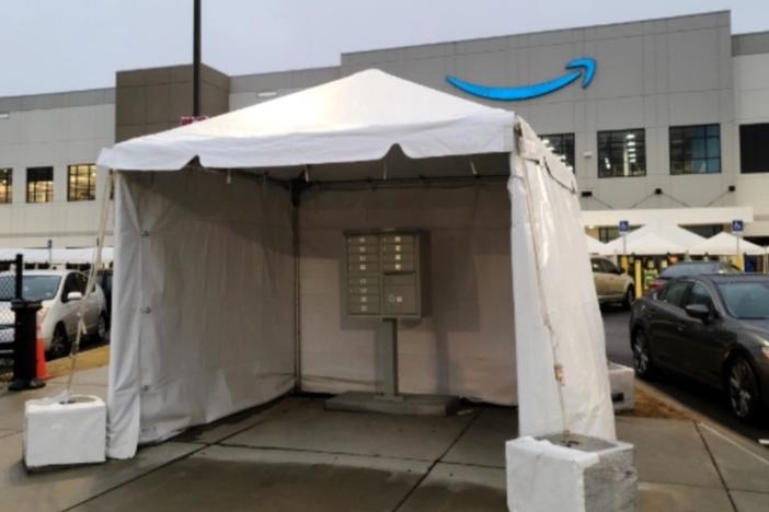 During last year's high-profile union vote, an Amazon-branded tent cloaks a mailbox outside the company's warehouse in Bessemer, Ala.