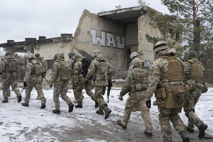 Members of Ukraine's Territorial Defense Forces, volunteer military units, train close to Kyiv on Saturday. Dozens of civilians have been joining Ukraine's army reserves in recent weeks amid fears about Russian invasion.