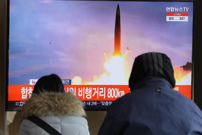 People watch a TV showing a file image of North Korea's missile launch during a news program at the Seoul Railway Station in Seoul, South Korea, on Sunday, the North's seventh missile test this month.