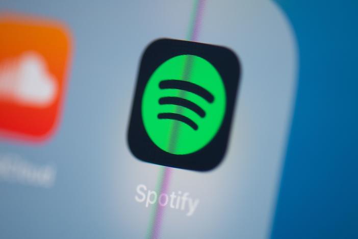 Spotify says it will add a content advisory to podcasts that discuss COVID-19.