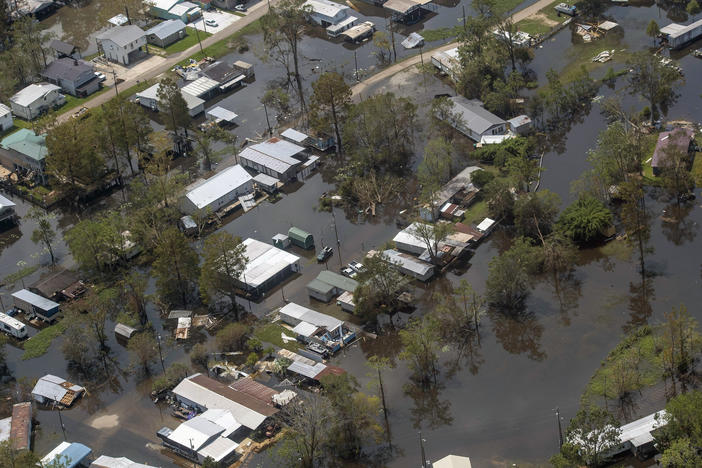 Heavy rain and storm surge from Hurricane Ida caused flooding from Louisiana to New England in September 2021. Homes in the town of French Settlement, La., were still underwater four days after the storm made landfall. Climate change is driving more flood risk in the U.S.