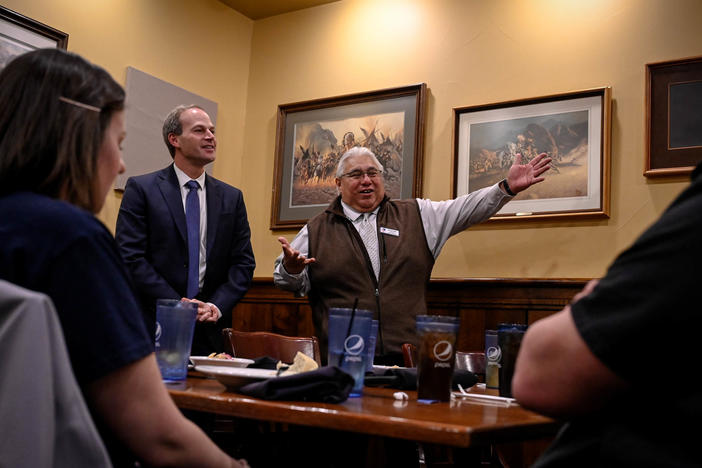 Sonny Subia, a volunteer with the League of United Latin American Citizens, introduces Michael Schneider, FBI special agent in charge, to a group largely composed of Latino middle and high school students in Greeley, Colo., on Jan. 28.