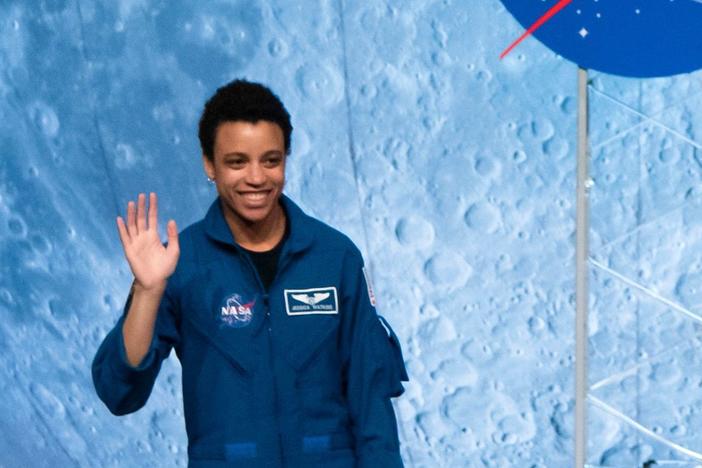 NASA astronaut Jessica Watkins waves at the audience during the astronaut graduation ceremony at Johnson Space Center in Houston Texas, on January 10, 2020.