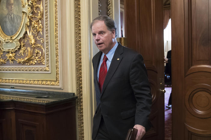 Former Sen. Doug Jones of Alabama, seen here in a 2018 file photo, has been tapped to help President Biden's to-be-named Supreme Court nominee through the Senate confirmation process.