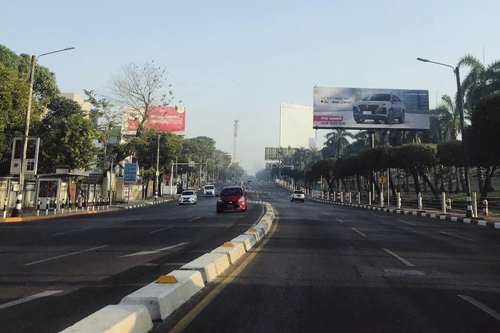 Few vehicles drive along Pyay Road, a main avenue that's usually busy with vehicular traffic, on Tuesday, Feb. 1 in Yangon, Myanmar. Opponents of military rule in Myanmar on Tuesday marked the one-year anniversary of the army's seizure of power with a nationwide strike to show their strength and solidarity.