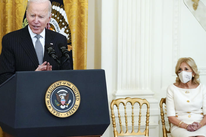 First lady Jill Biden listens as President Biden speaks during a "Cancer Moonshot" event at the White House on Wednesday. According to the White House, her advocacy for cancer education and prevention began in 1993, when four of her friends were diagnosed with breast cancer.