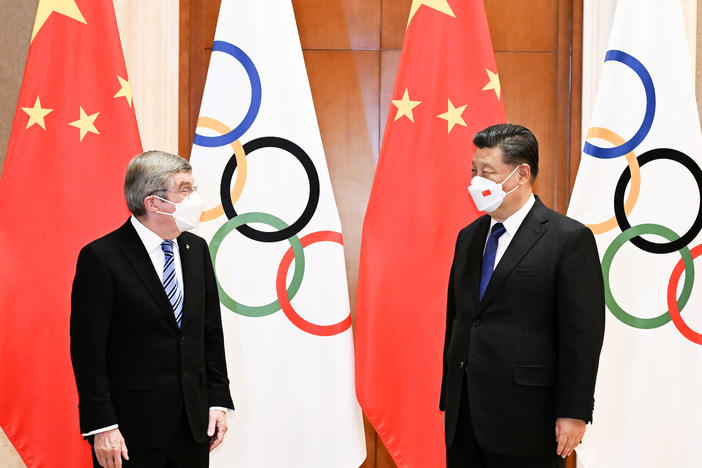 Chinese President Xi Jinping (right) meets with the president of the International Olympic Committee, Thomas Bach, in Beijing on Jan. 25. Xi said his country was ready to host a "simple, safe and splendid Winter Olympics." The Olympics formally open on Friday.