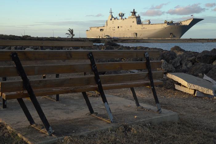 This photo shows the Australian Navy's HMAS Adelaide docked at Vuna Wharf in Tonga's capital Nukualofa on Jan. 26 to deliver aid following the Jan. 15 eruption of the nearby Hunga Tonga-Hunga Haapai underwater volcano. Tonga's deputy chief of mission in Australia Curtis Tu'ihalangingie told Reuters that the infected dock workers were not at the same wharf the HMAS Adelaide docked at.