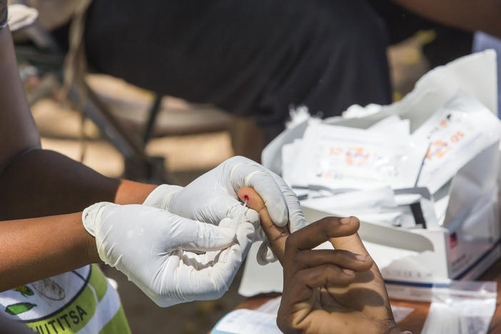 Testing blood for malaria at a Doctors Without Borders clinic in Malawi.