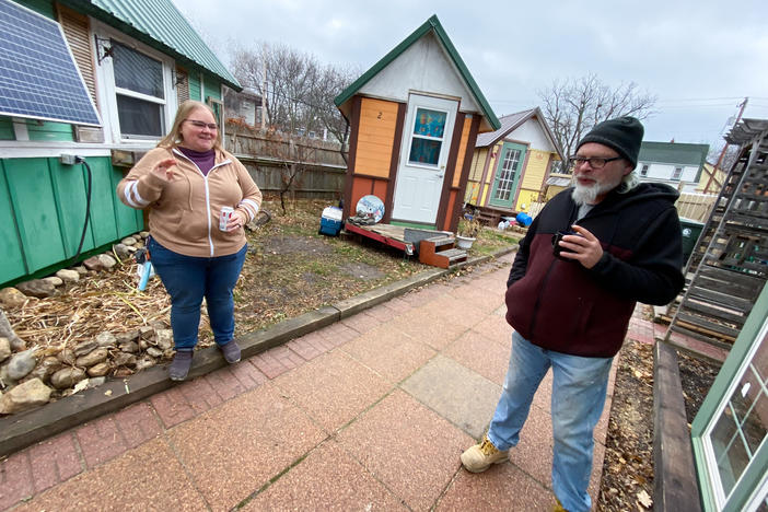 Gene Cox speaks with Brenda Konkel, president of Occupy Madison and executive director of Madison Area Care for the Homeless OneHealth. Occupy Madison provides tiny houses for people experiencing homelessness in Madison, Wisconsin.
