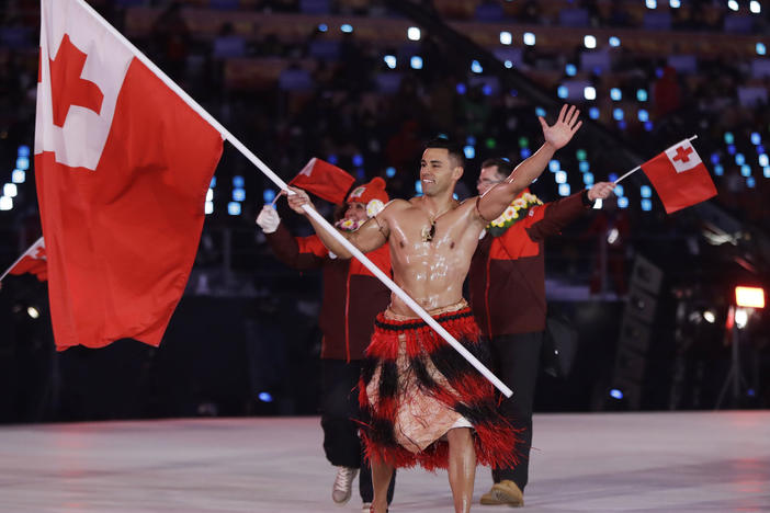 Pita Taufatofua makes an entrance during the opening ceremony of the 2018 Pyeongchang Winter Olympics. Taufatofua competed in taekwondo and cross-country skiing, but he's most famous for carrying the flag of Tonga for three consecutive Games, stealing the show each time.