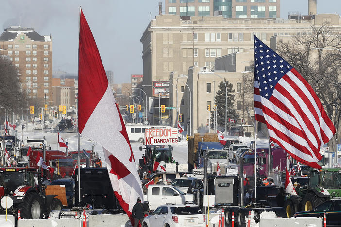 Demonstrators rally against provincial and federal COVID-19 vaccine mandates and in support of Ottawa protestors on Friday outside the Manitoba Legislature in Winnipeg.