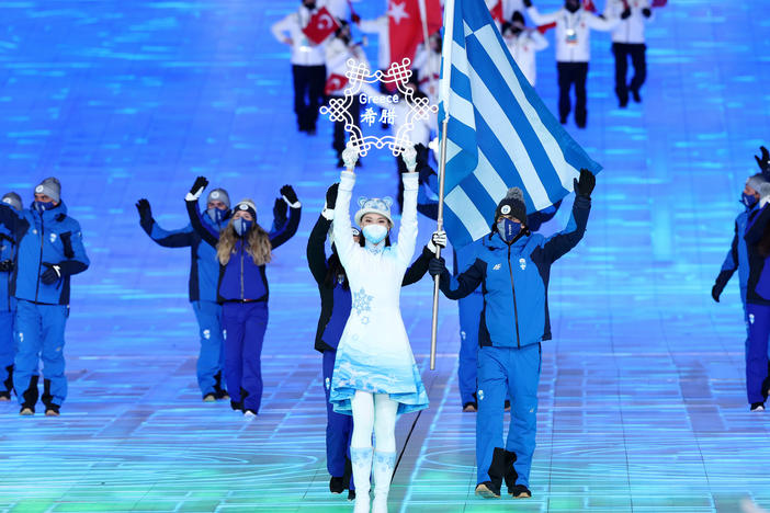 Flag bearers Apostolos Angelis and Maria Ntanou of Team Greece carry the flag of Greece during the Opening Ceremony of the Beijing 2022 Winter Olympics on February 04, 2022.