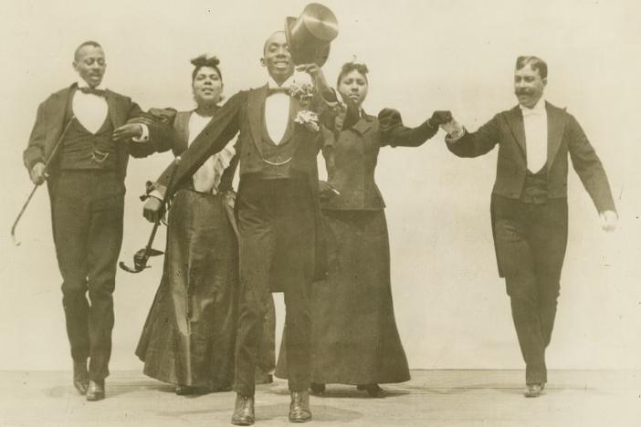 Dancers performing the Cakewalk.