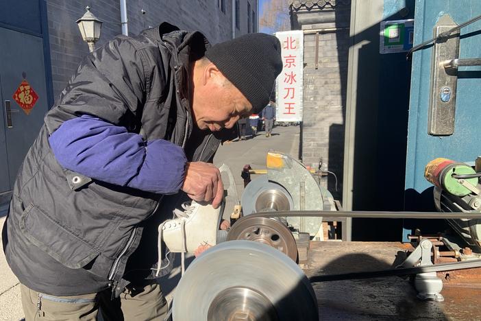 Wang Jianzhi, who runs a blade sharpening shop in Beijing, has no plans to watch the Games: "Where should I get the time to watch Olympic figure skating?"