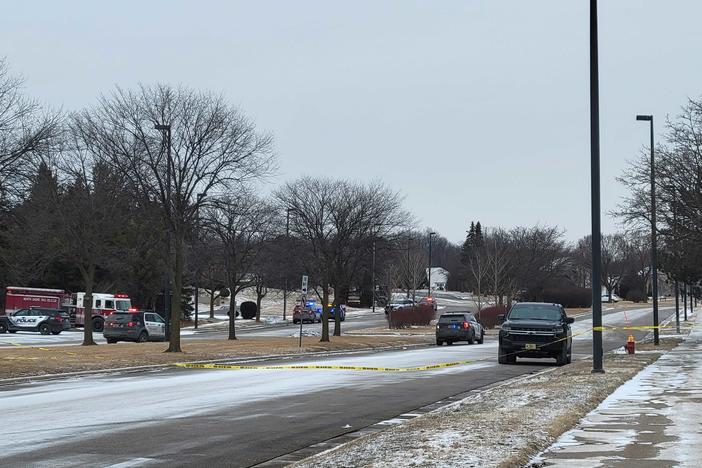 Officials respond to a shooting in Brown Deer, Wis. Three people are dead, including the suspect, police said.