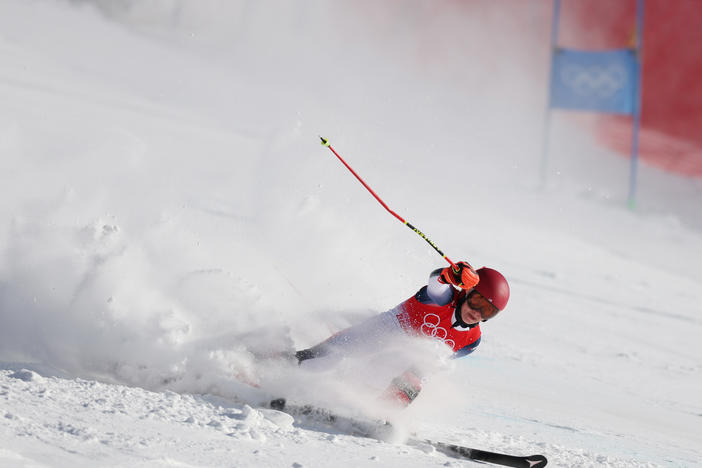 Mikaela Shiffrin falls during the women's giant slalom on day three of the Beijing 2022 Winter Olympic Games.