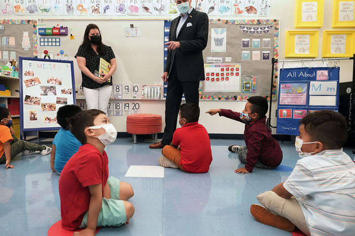 New Jersey Gov. Phil Murphy talks to 3- and 4-year-old students in a pre-K class at the Dr. Charles Smith Early Childhood Center in September 2021 in Palisades Park, N.J.