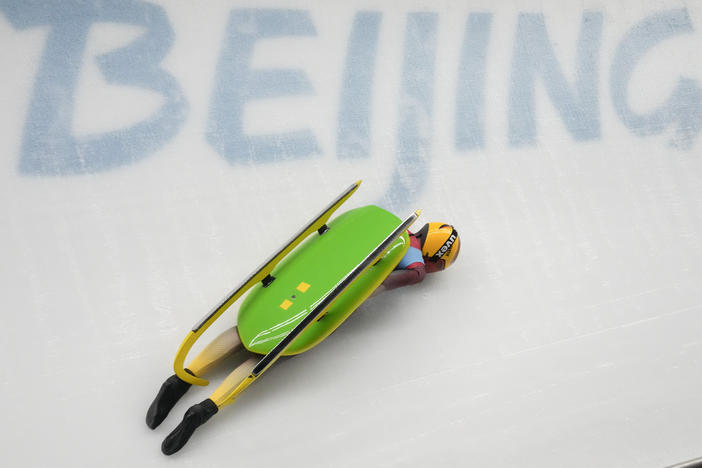 Julia Taubitz, of Germany, crashes during the luge women's singles run 2 at the 2022 Winter Olympics, Monday, Feb. 7, 2022, in the Yanqing district of Beijing.