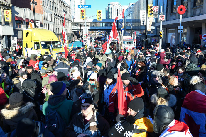 Demonstrators opposed to the Canada's COVID-19 mandates block the streets of Ottawa as they continue to protest on Saturday.