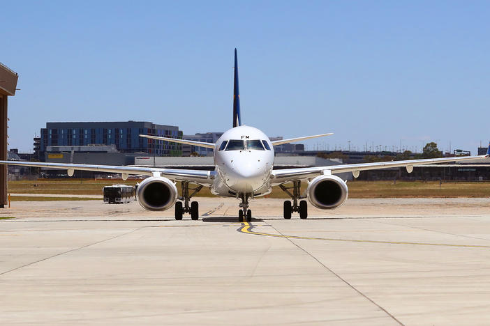 A plane sits at Melbourne Airport in December, ahead of the Australian Open. The country will reopen its international borders to visa holders and fully vaccinated travelers on Feb. 21.