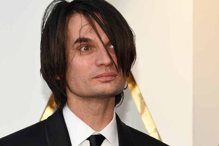 Composer Jonny Greenwood arrives for the Academy Awards on March 4, 2018, in Hollywood, Calif. Greenwood was nominated for an Oscar his work on  <em>Phantom Thread.</em>