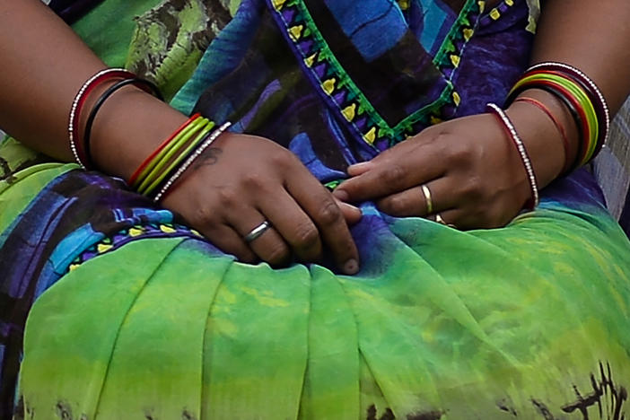 A photograph of a woman who says she was a victim of marital rape. She is posing outside near her home in New Delhi. The Delhi High Court is now considering petitions that call for the criminalization of marital rape.