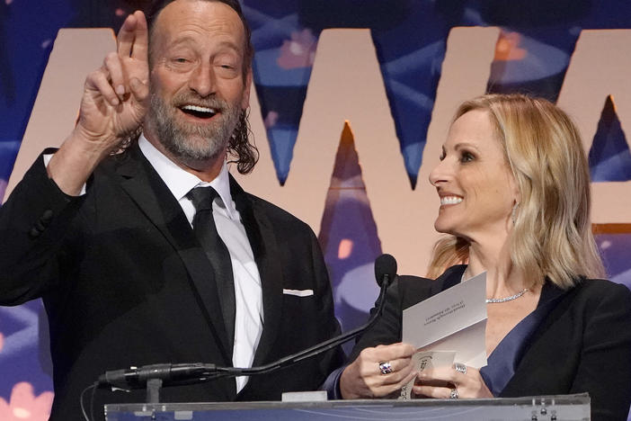 Troy Kotsur says his character in the film <em>CODA</em> is "kinda like a papa bear." The Oscar nominee is seen here with co-star Marlee Matlin in New York City last November.
