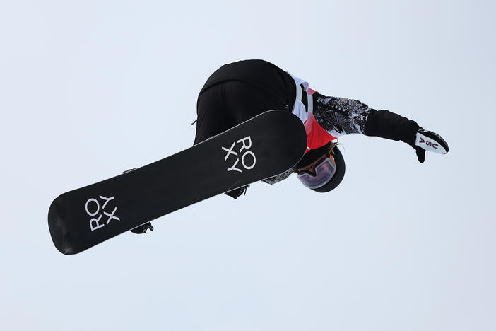 Returning snowboard halfpipe champ, Chloe Kim, performs a trick during qualification at the Beijing 2022 Winter Olympic Games.