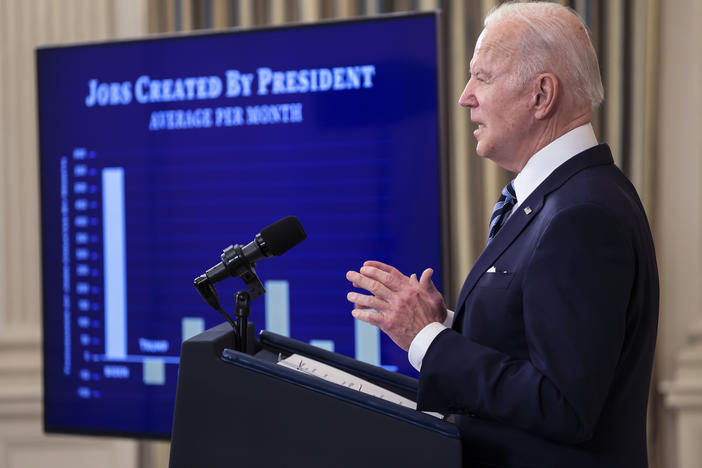 President Biden showed off a chart comparing strong job creation during his first year to that of previous presidents. But economists say surging inflation is top of mind to voters.