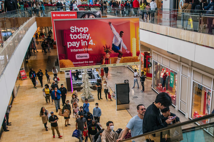 An ad for Klarna's "buy now, pay later" offer overlooks mall goers in Houston.