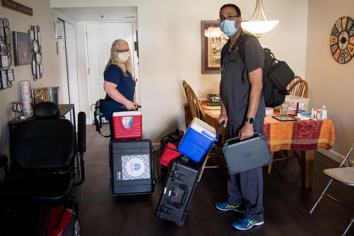 Nurse Tami Hampson and Dr. Vinay Shah with DispatchHealth arrive at the Wiese family's apartment for a medical visit on January 3, 2022.