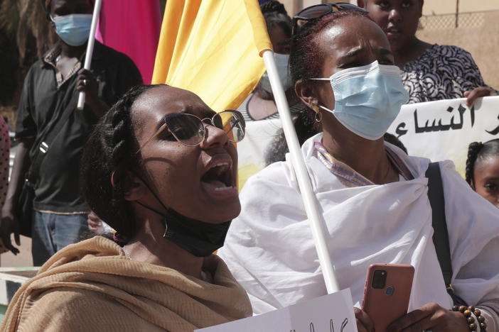 Women chant slogans protesting violence against women and demanding the release of all detainees before the U.N. rights office in Khartoum, Sudan, Feb. 2, 2022.