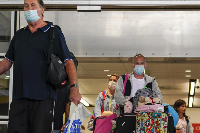 Passengers arriving at Gatwick Airport in London. Starting today, British residents and visitors who have had at least two doses of a coronavirus vaccine only need to fill out a form before entering the U.K.