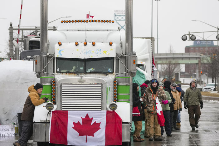 Truckers and supporters block the access leading from the Ambassador Bridge linking Detroit, Mich., and Ontario as they continue to protest against COVID-19 vaccine mandates and restrictions on Friday.