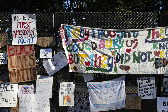 Banners and signs are hung on a fence at Lafayette Square near the White House, during ongoing protests against police brutality and racism in June 2020. The Library of Congress has digitized some of the pieces of artwork, signs and photographs once displayed on the fence.