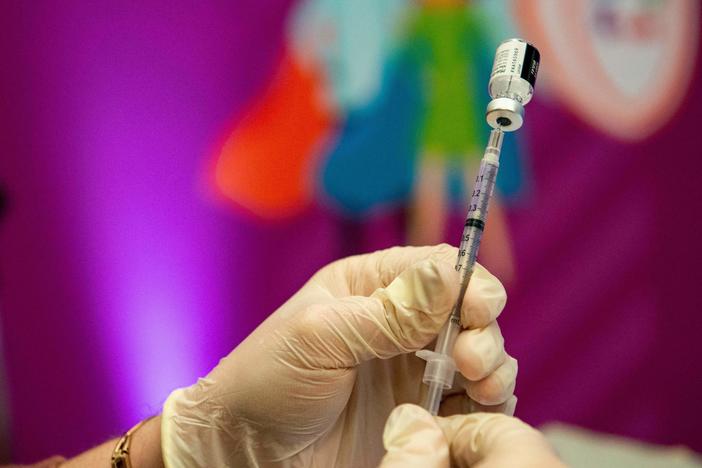 A medical worker prepares the Pfizer-BioNTech Covid-19 vaccine booster in Hartford, Connecticut, in January.