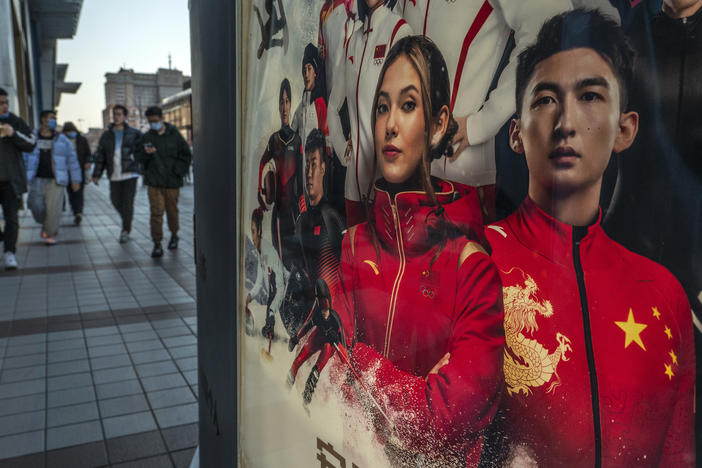 An ad for Chinese sportswear company shows American-born freestyle skiing gold medalist Eileen Gu, or Gu Ailing and other athletes competing for China at the Beijing 2022 Winter Olympics on a street on last week in Beijing.