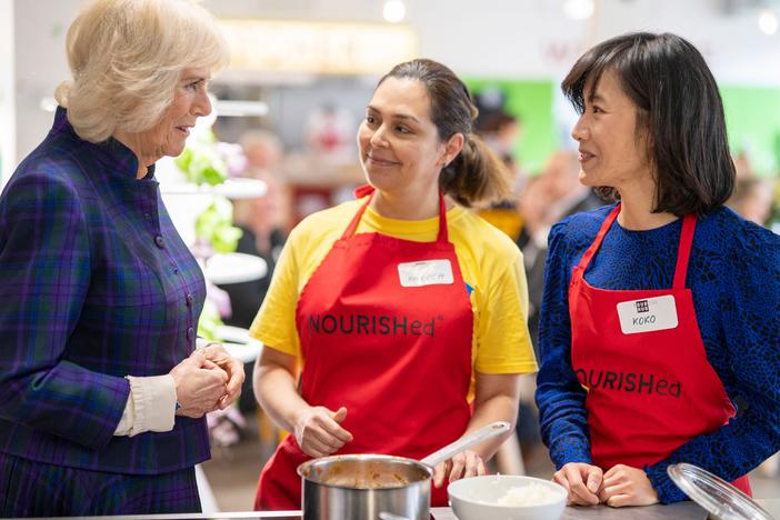 Britain's Camilla, Duchess of Cornwall speaks to members of staff as she attends the opening of the charity and community Kitchen "Nourish Hub," created to fight against social isolation and loneliness, in west London on Thursday.