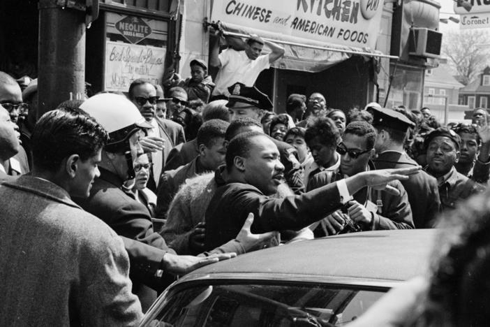 Martin Luther King Jr. leads a civil rights march to Boston Common in Massachusetts in 1965.<em> </em>