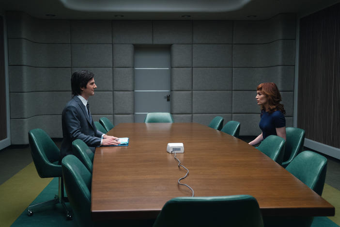 Mark (Adam Scott) greets new employee Helly (Britt Lower) in the Apple TV series <em>Severance</em>.