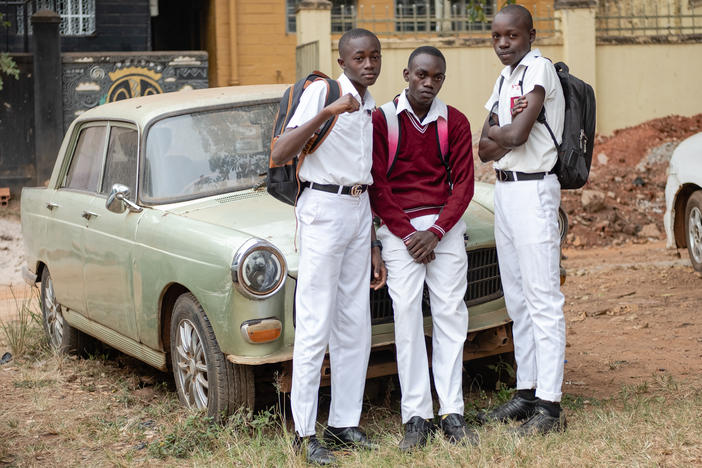 Kusemererwa Jonathan Henry, Joel Joseph (left and middle) and a friend pose for a photo on their way home from school. During the lockdown, they missed spending time in school together and would walk to visit each other.