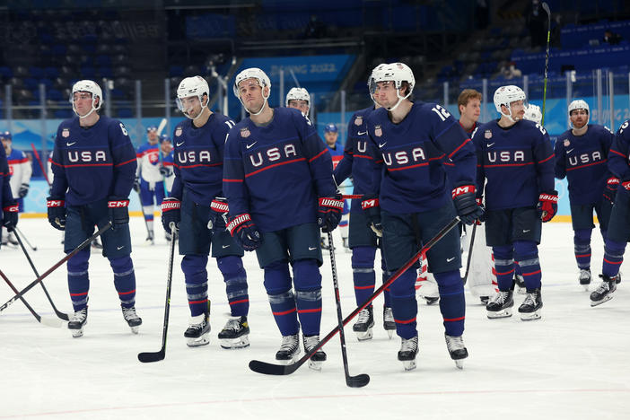 Team USA reacts after losing to team Slovakia in a penalty-shot shootout during the men's ice hockey quarterfinal match against Team Slovakia at the Beijing 2022 Winter Olympic Games.